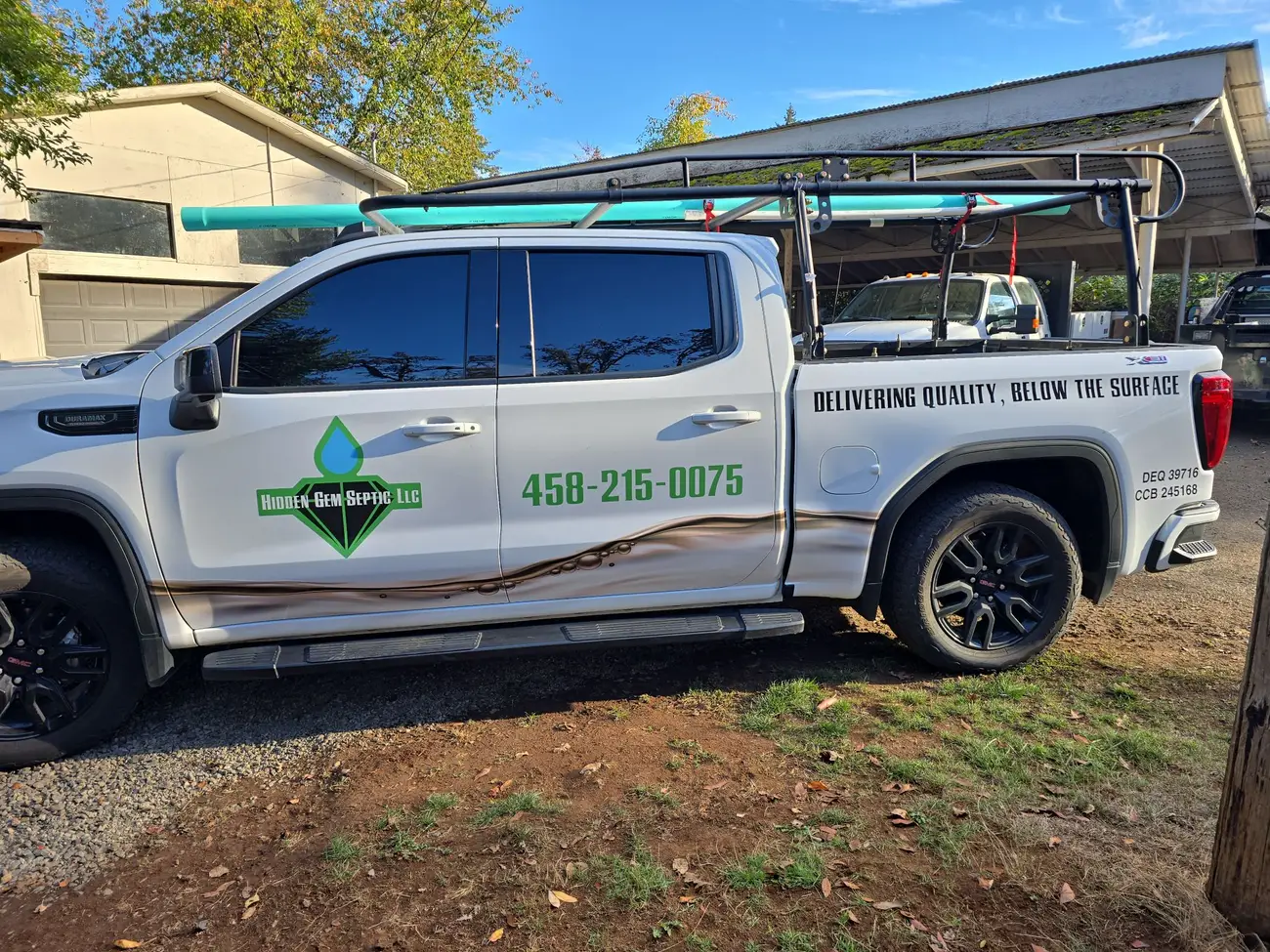 The Hidden Gem Septic work truck with the diamond logo and phone number on the door
